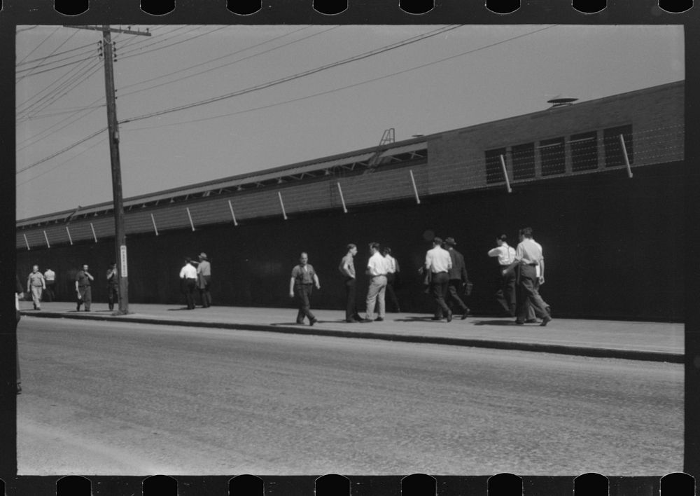 [Untitled photo, possibly related to: Buses which take many workers home in front of United Aircraft, Pratt and Whitney…