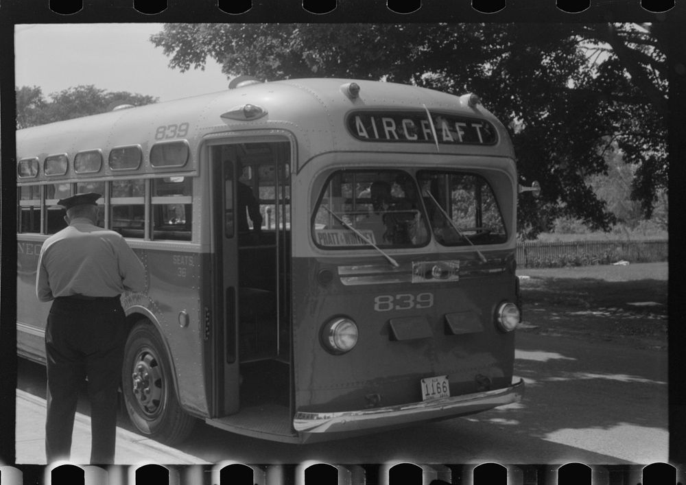 [Untitled photo, possibly related to: Buses which take many workers home in front of United Aircraft, Pratt and Whitney…