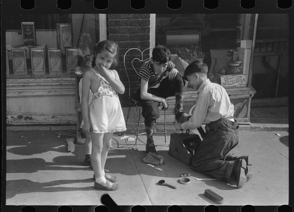 [Untitled photo, possibly related to: Children shining shoes on street corner, Hartford, Connecticut]. Sourced from the…