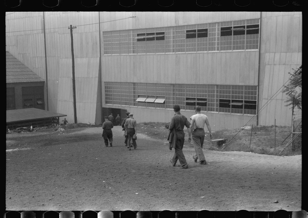 Workers entering plant at afternoon change of shift. Electric Boat Works, Groton, Connecticut. Sourced from the Library of…