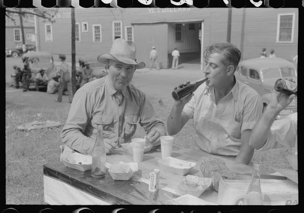 [Untitled photo, possibly related to: Brunswick stew dinner in front of the tobacco warehouse on opening day of the…