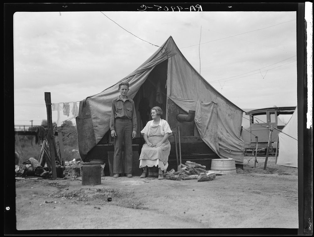 Part of migrant family of five encamped near Porterville, California, while waiting for work in the orange groves. Sourced…