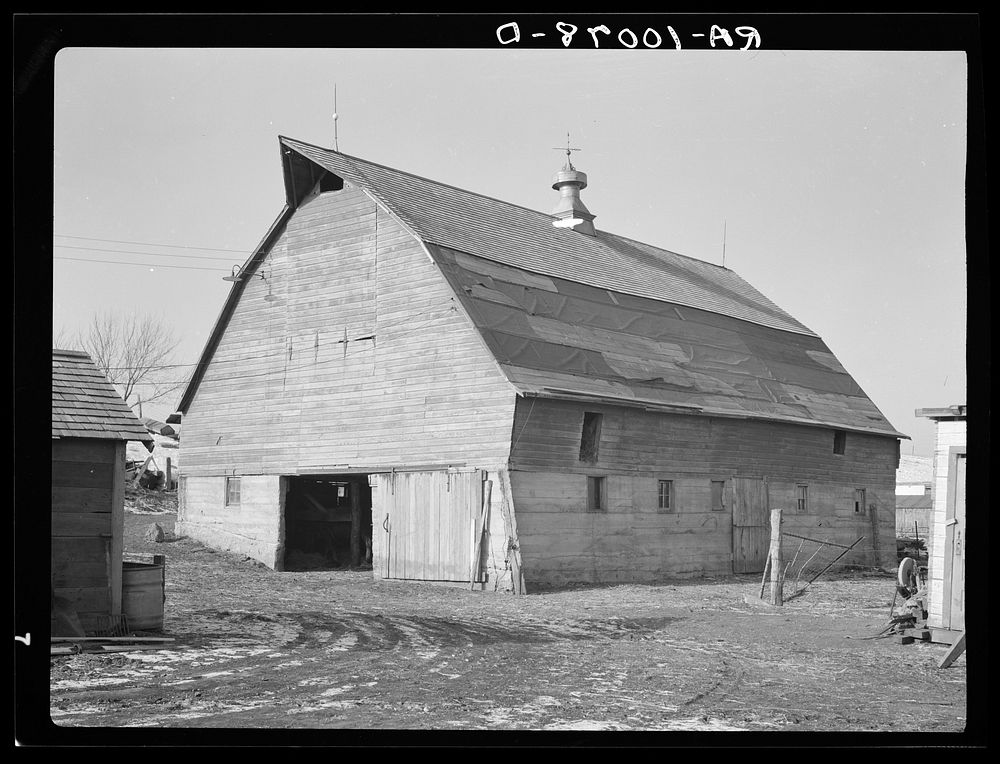 Barn on J.E. Herbrandson farm near Estherville, Iowa. Owner-operated. This farm is under heavy mortgage. It was bought…