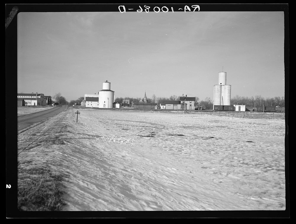 View of Dickens, Iowa, showing elevators and railroad station by Russell Lee