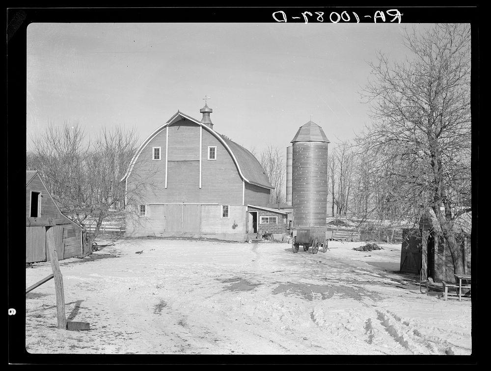 Barn and silo on H.H. Tripp farm near Dickens, Iowa. Two hundred acres. Rents from mother on crop share lease. These are…