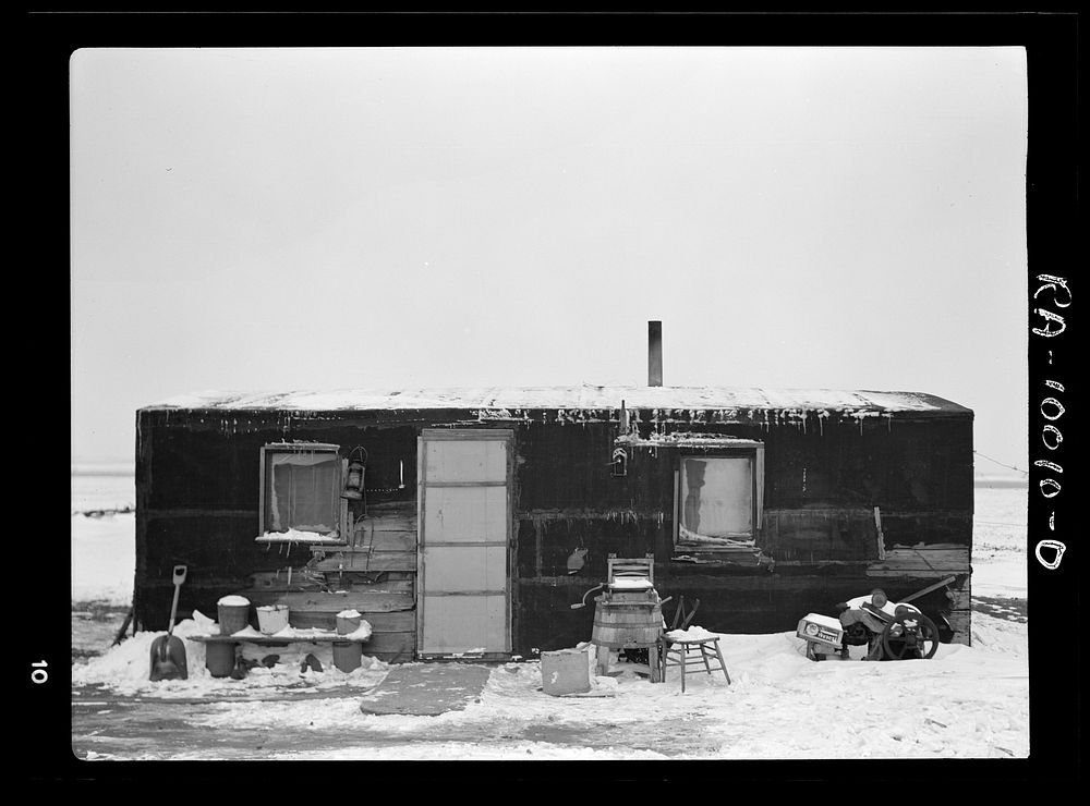 Three-room shack, the residence of L.H. Nissen, hired man for a tenant farmer. Farm is owned by a loan company. Ten people…