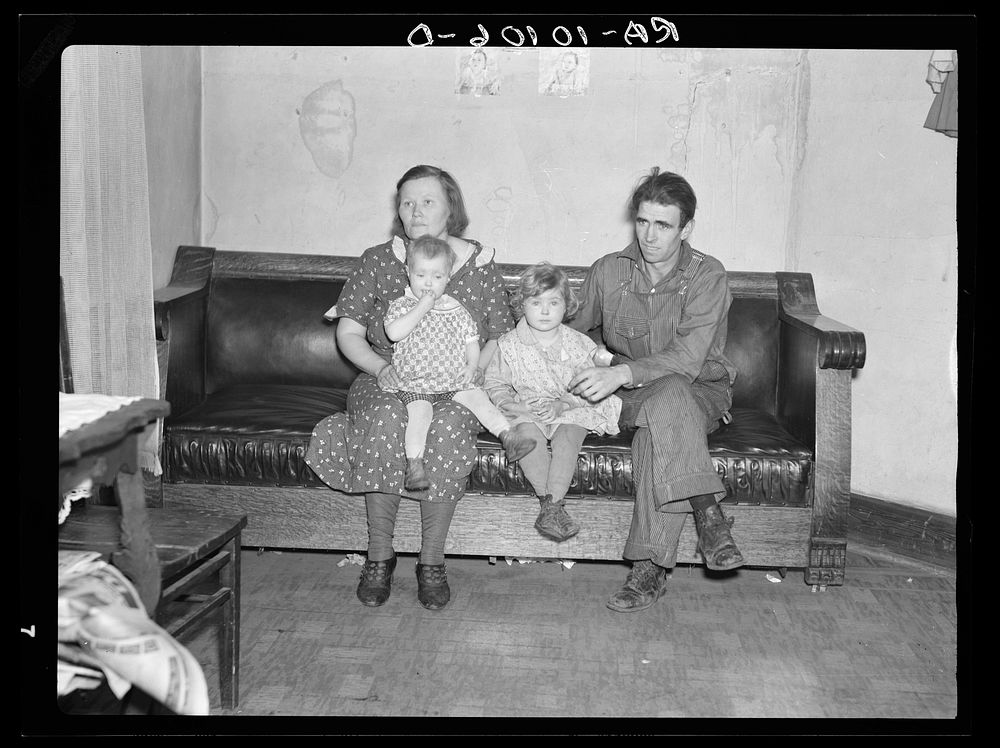 Paul Rauhauser, thirty-eight, with his wife and two of their seven children. Living in Ruthven, Iowa by Russell Lee