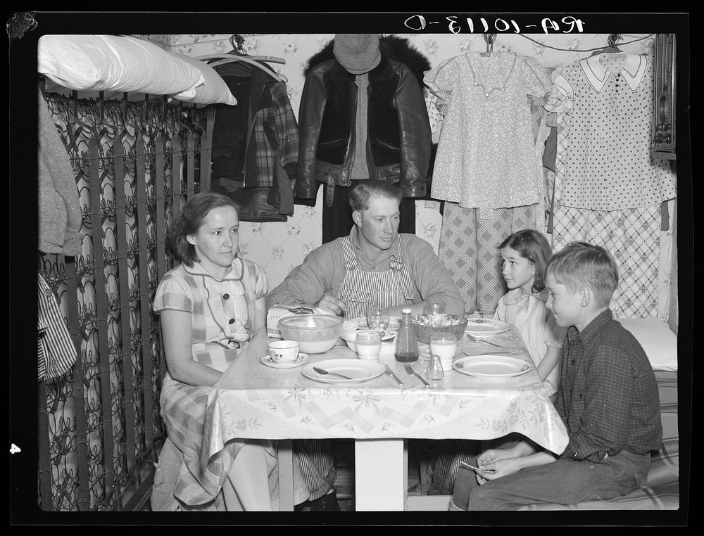 Marcus Miller and family in shack that he built himself. Spencer, Iowa. This is half the house. Miller is a hired hand who…