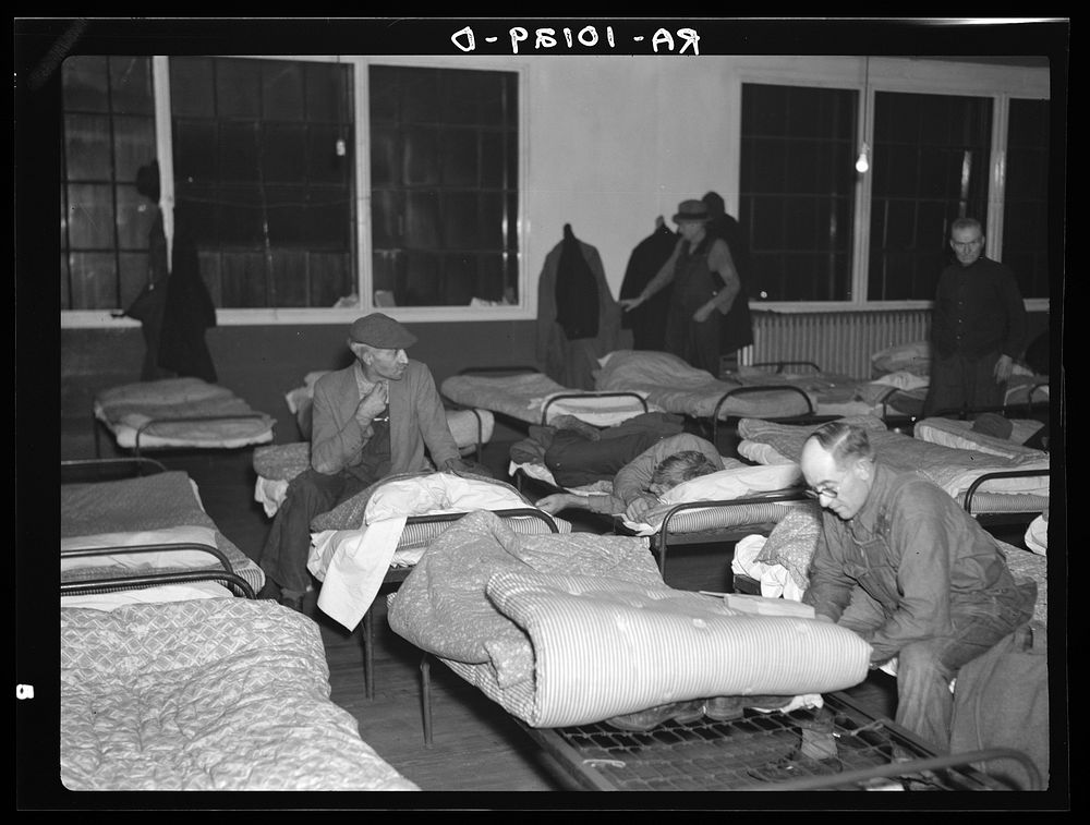 Men's dormitory at night at the homeless men's bureau, Sioux City, Iowa (for unattached men). Unemployment is the primary…