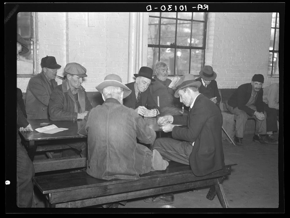 A card game in the recreation room of the homeless men's bureau. Sioux City, Iowa (for unattached men) by Russell Lee