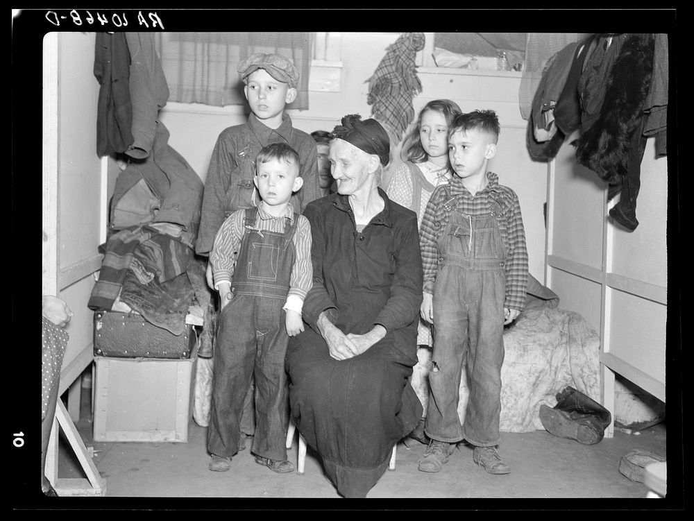 Group of children being cared for by an old lady; all of them flood refugees. Sikeston, Missouri by Russell Lee