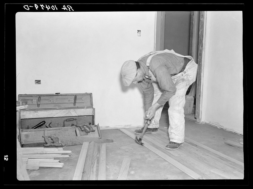 Laying a hardwood floor. Greenhills project, Ohio by Russell Lee