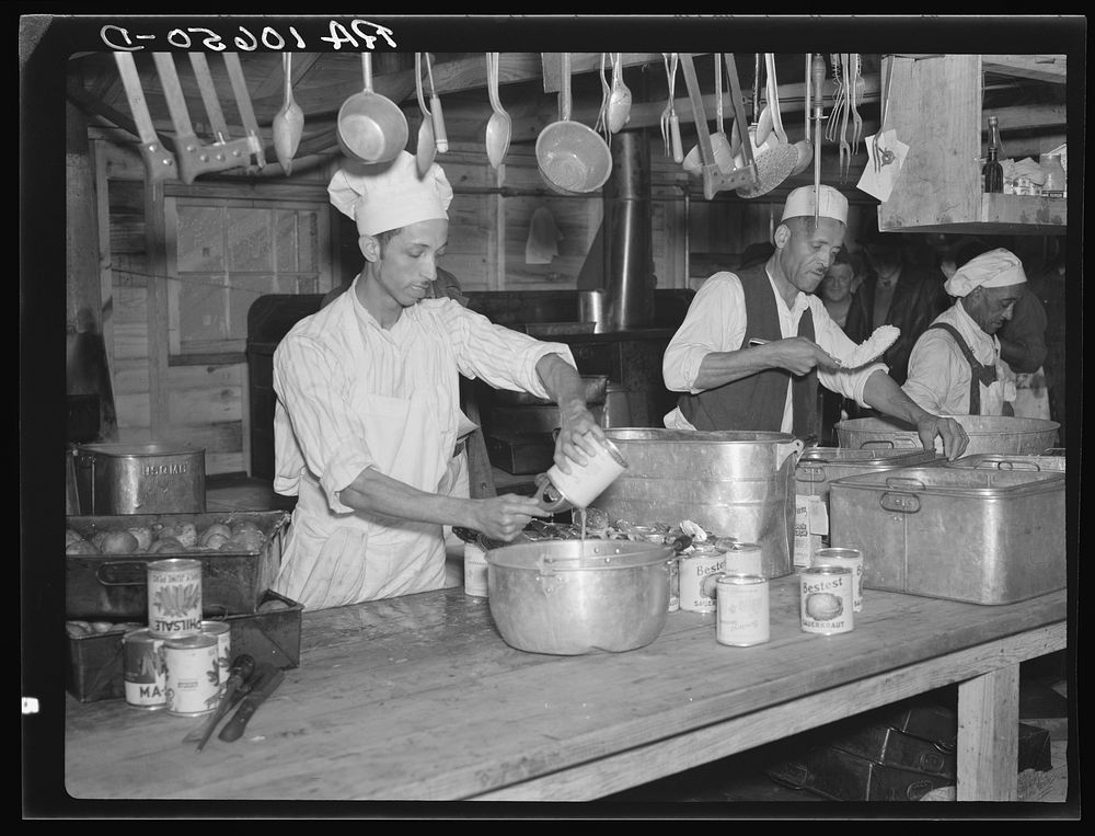 Preparing dinner for the six hundred fifty flood refugees encamped at Tent City near Shawneetown, Illinois by Russell Lee