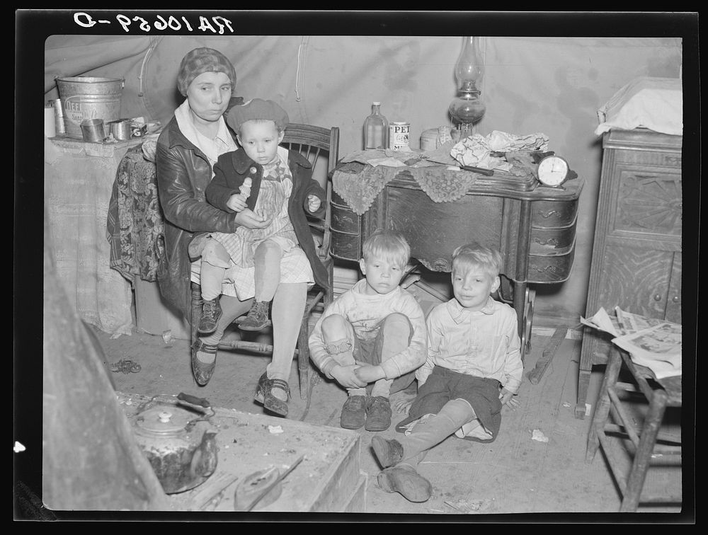 Part of flood refugee family in a tent at Tent City, near Shawneetown, Illinois by Russell Lee