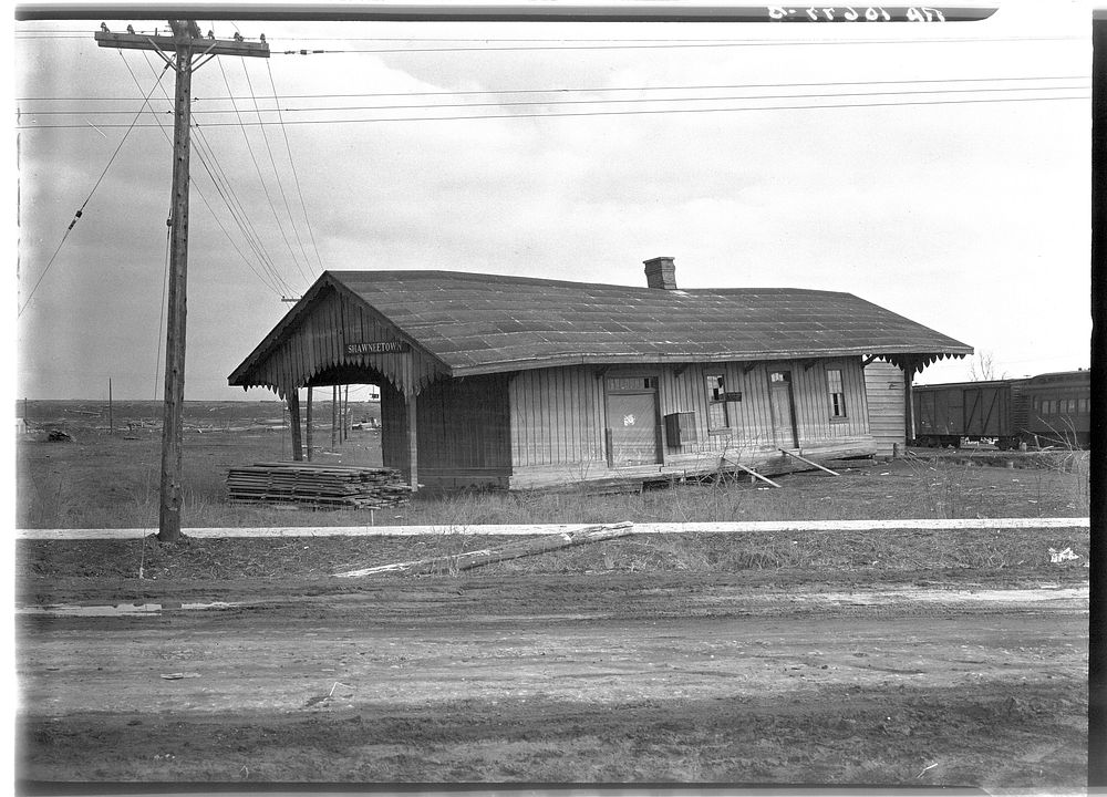 The old Louisville and Nashville Railroad station after the flood. Shawneetown, Illinois. Note flood marks on building by…