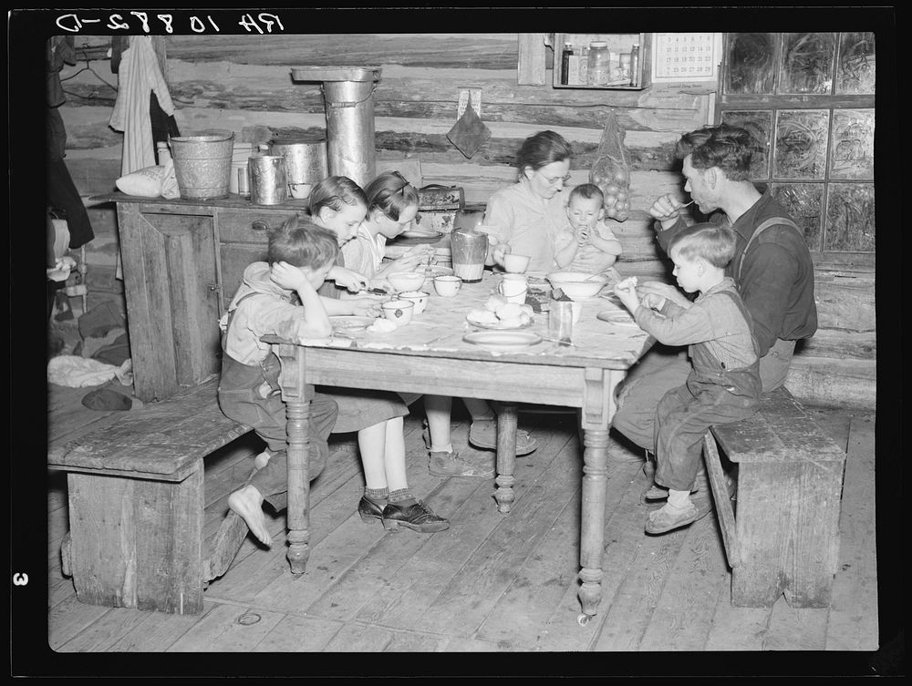 Dinner in the home of William Howell. Near Tipler, Wisconsin by Russell Lee