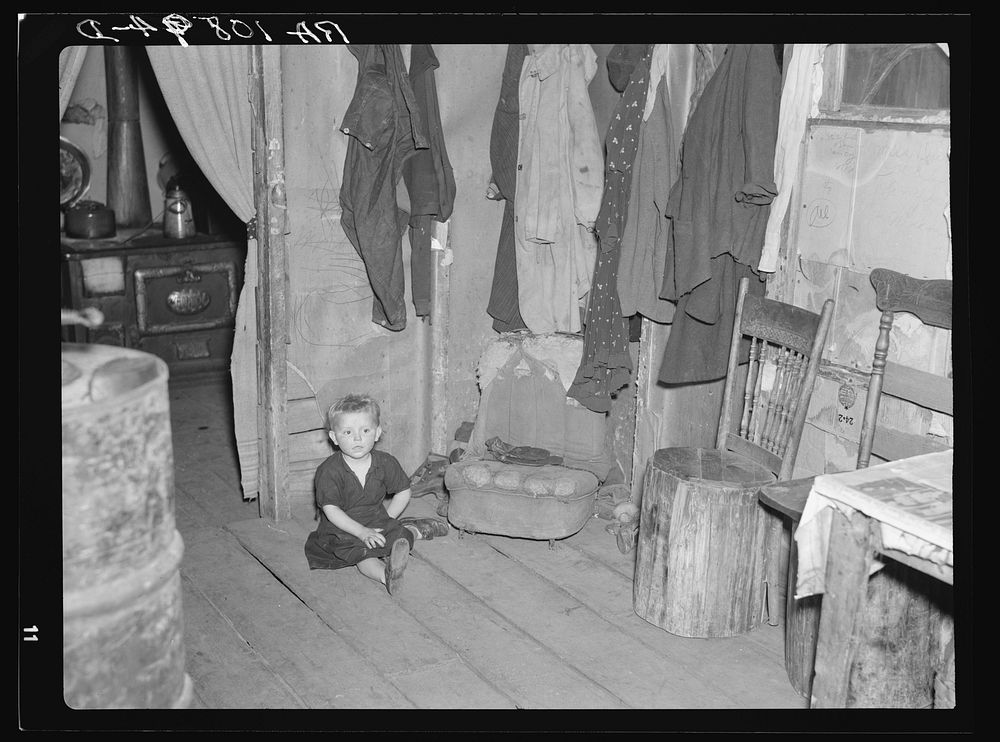 One of Max Sparks' children in their home near Long Lake, Wisconsin. This child is a deaf mute by Russell Lee