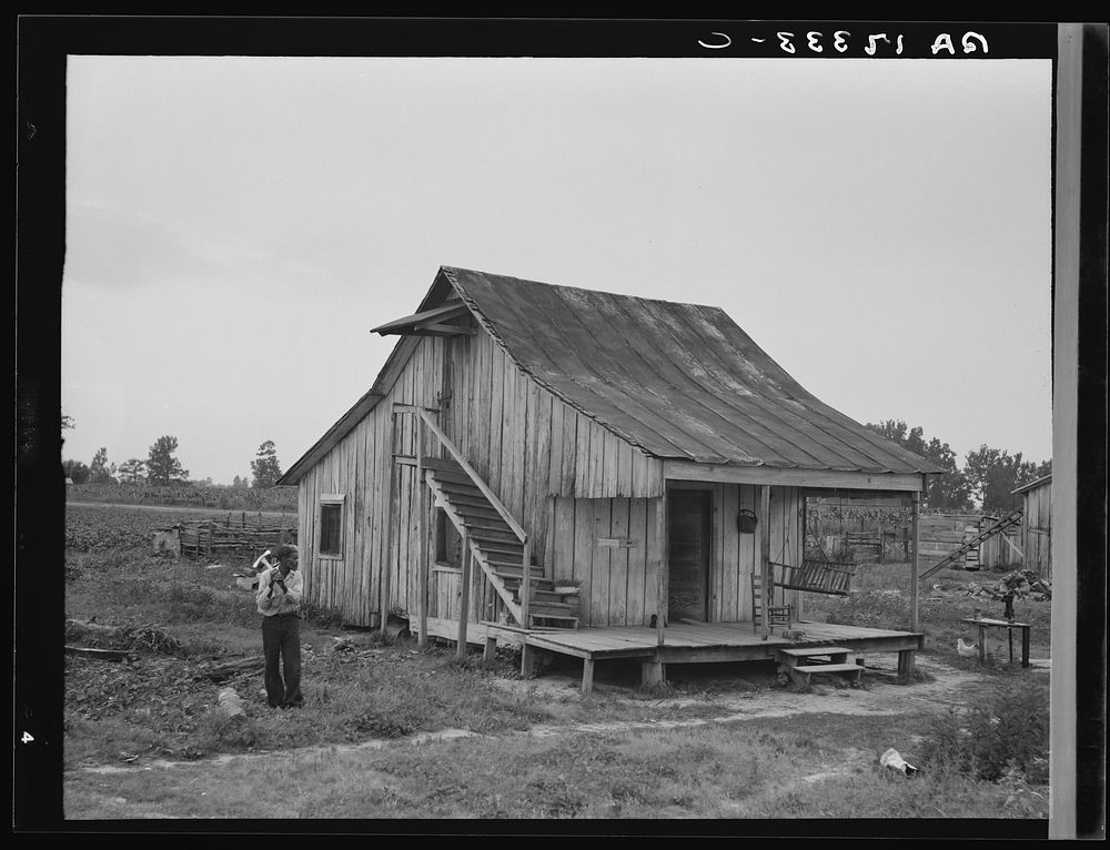 Cottonworker's cabin with outside stairway and loft. Near Blytheville, Arkansas. Sourced from the Library of Congress.