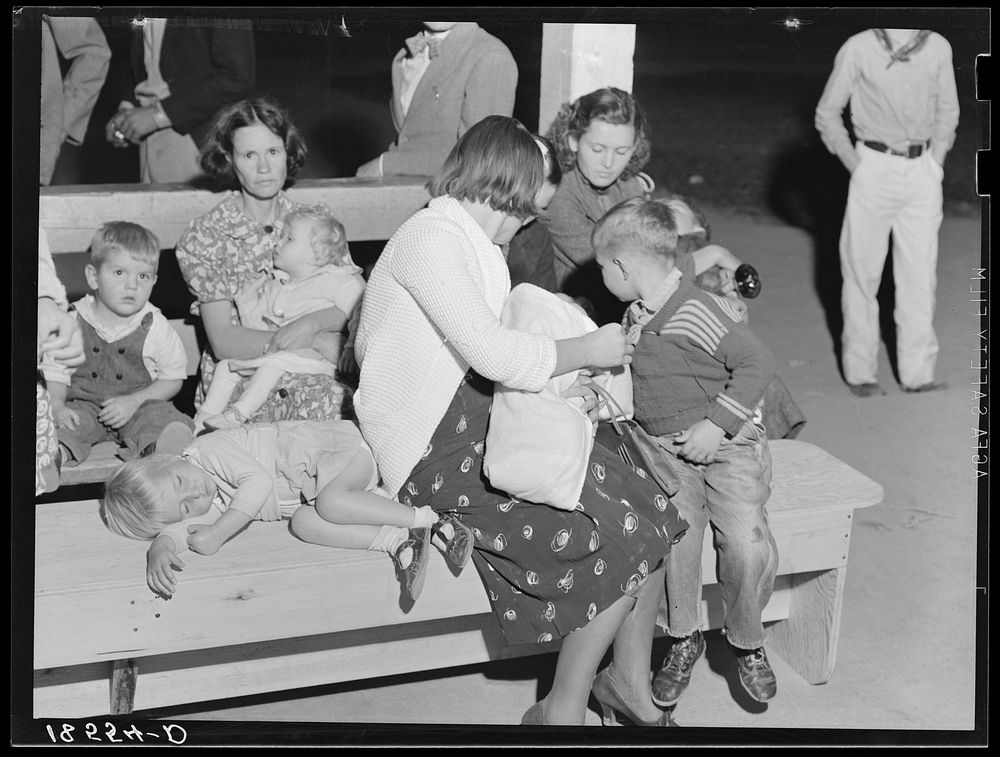 Tired mothers and tired children at the end of the Halloween party at Shafter migrant camp, California. Sourced from the…