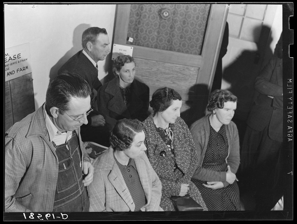 [Untitled photo, possibly related to: Night meeting in the Farm Security Administration office, Rural Rehabilitation…