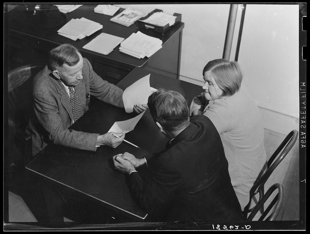 Night meeting in the Farm Security Administration (FSA) office, Rural Rehabilitation Division, Visalia, Tulare County…