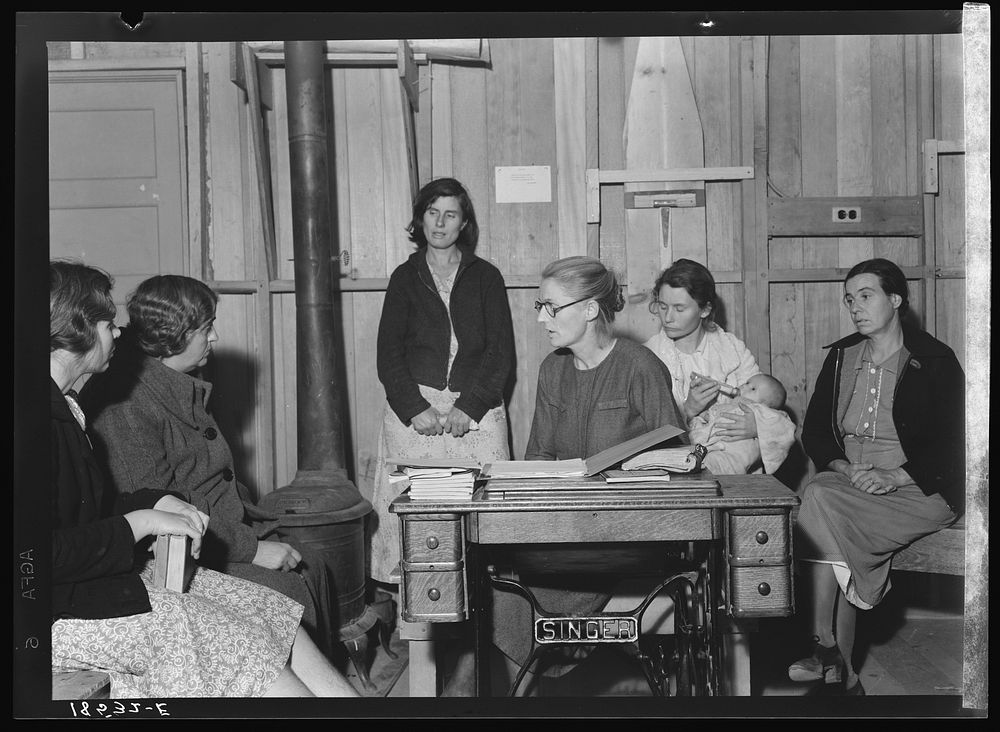 Meeting of the Mothers' Club in Arvin camp for migrant workers, a Farm Security Administration (FSA) camp. The discussion…