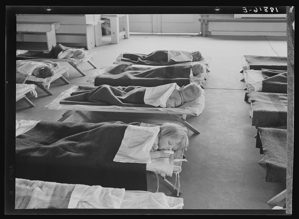 Rest time in nursery school for migrant children at Shafter Camp, California by Dorothea Lange