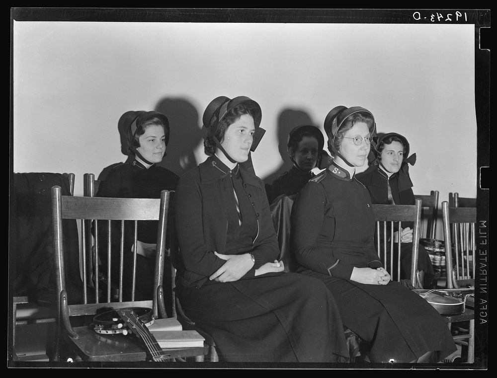 Visiting lassies sit on rostrom. Salvation Army, San Francisco, California. Sourced from the Library of Congress.
