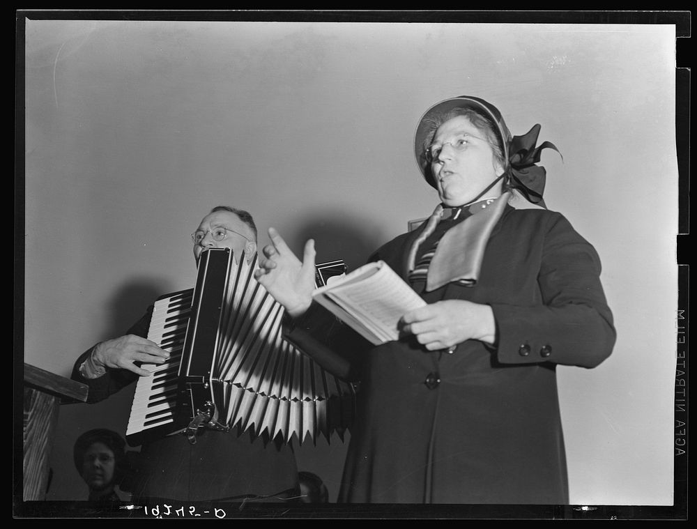 Adjutant and his wife sing. Salvation Army, San Francisco, California. Sourced from the Library of Congress.