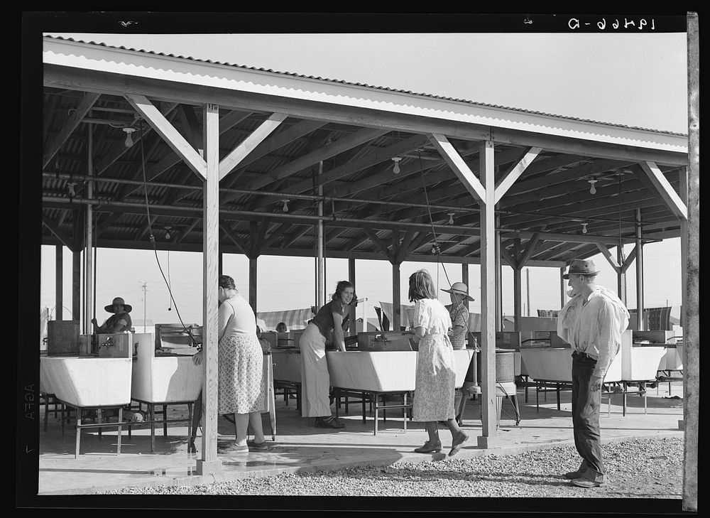 Laundry facilities for migratory workers in Farm Security Administration (FSA) camp at Westley, California. Sourced from the…