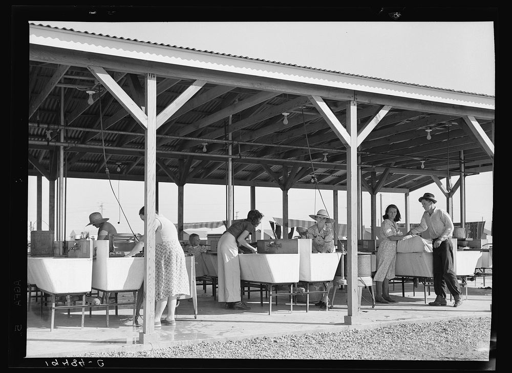 Laundry facilities in Farm Security Administration (FSA) camp for migrant labor. Westley, California. Sourced from the…