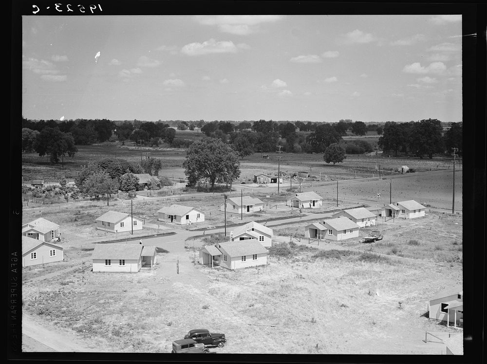 [Untitled photo, possibly related to: Partially completed homes for agricultural workers to enable them to settle…