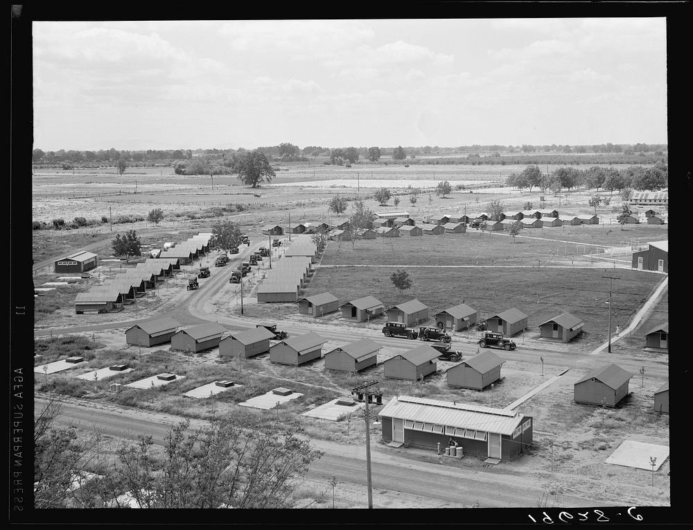 [Untitled photo, possibly related to: Same as 19635. General view of one end of camp showing three units of the camp, each…