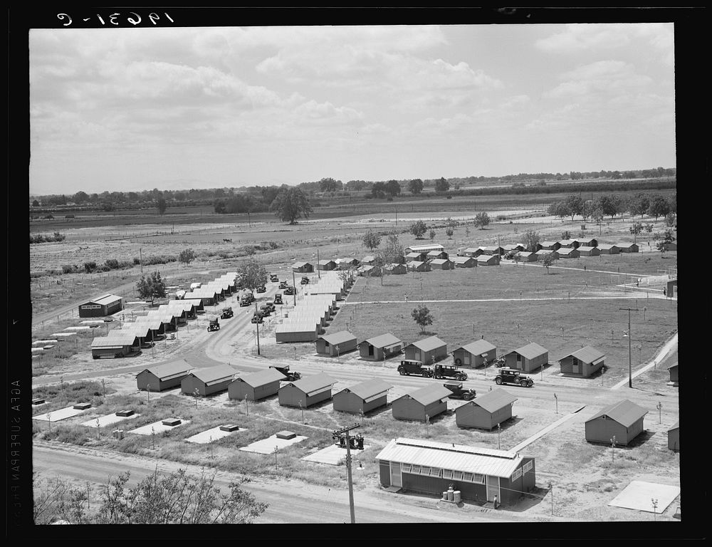 Same as 19635. General view of one end of camp showing three units of the camp, each with its sanitary building.…