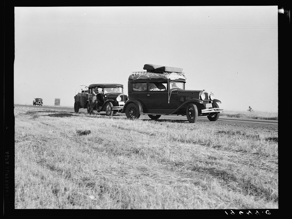 Between Tulare and Fresno (see general caption). Two families originating from Independence, Kansas, on U.S. 99. Started out…