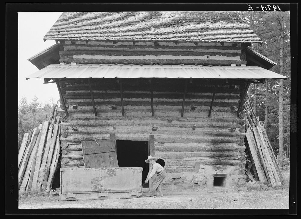 [Untitled photo, possibly related to: Tobacco barn ready for "putting in". Person County, North Carolina]. Sourced from the…