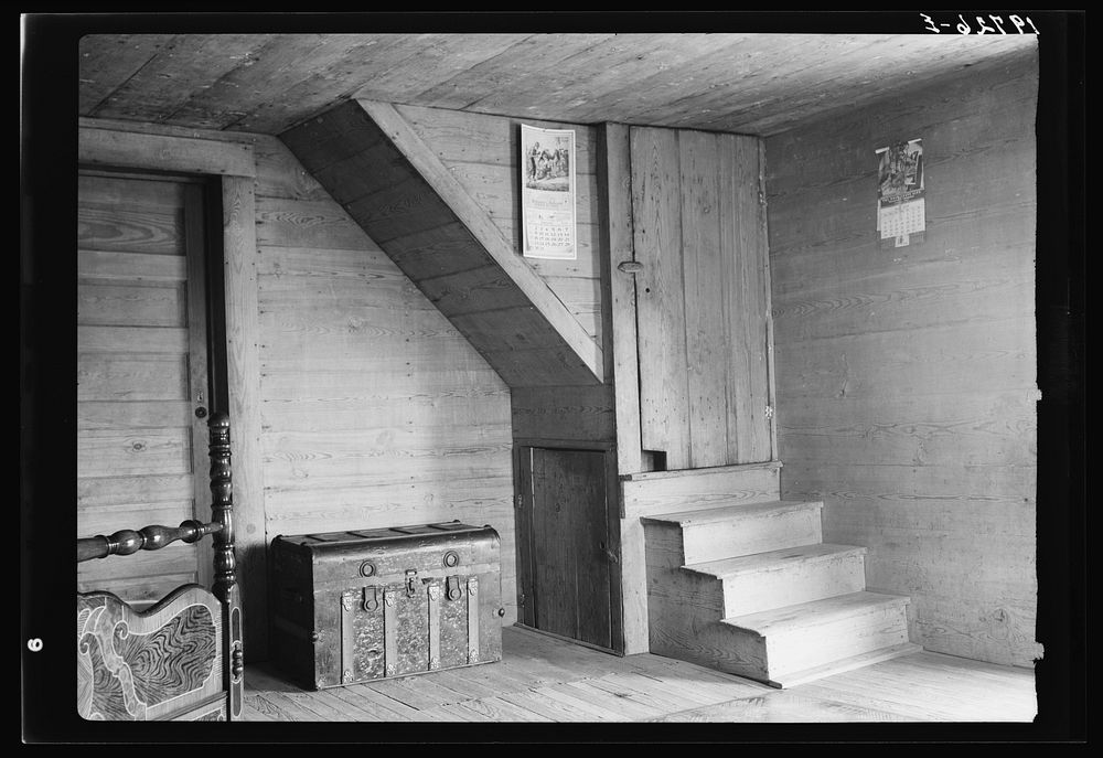 Corner of tobacco farmer's front room. Shows enclosed stairway and corner of the new fancy bed. Person County, North…