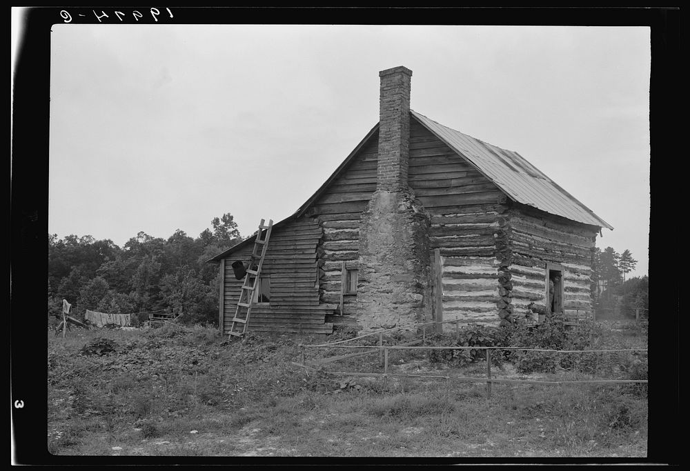  sharecropper house. Note chimney leanto with kitchen stove pipe stuffed through side of wall and cap off with joint of…