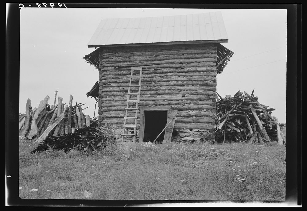 [Untitled photo, possibly related to: Wood stacked up preliminary to firing the tobacco. Person County, North Carolina].…