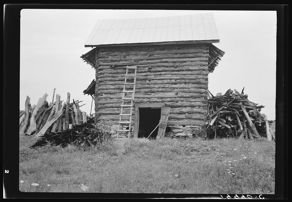 Wood stacked up preliminary to firing the tobacco. Person County, North Carolina. Sourced from the Library of Congress.