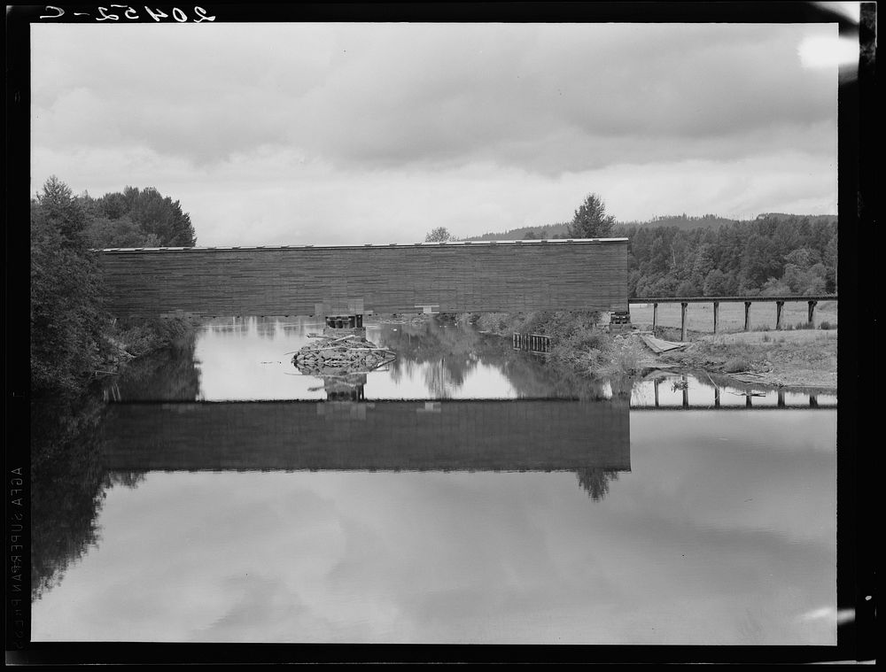Western Washington, Thurston County. Covered bridge over the Chehalis River, characteristic of the region. Sourced from the…