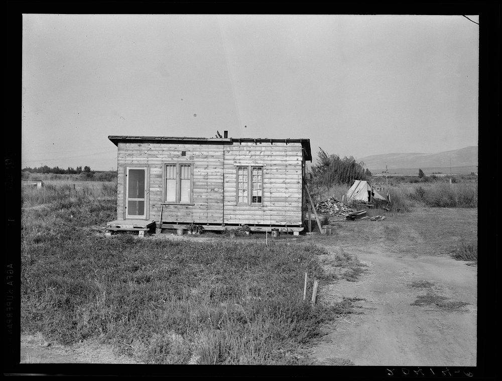 [Untitled photo, possibly related to: Washington, Yakima. Homes are built bit by bit with whatever materials are available.…