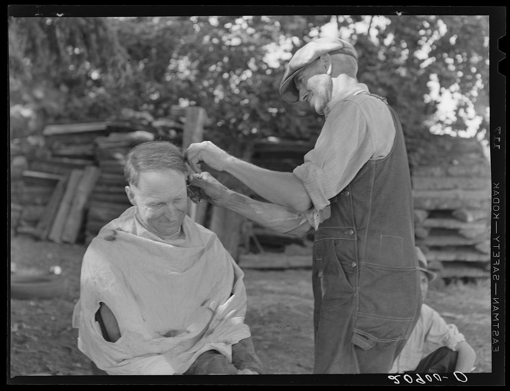 [Untitled photo, possibly related to: Bean pickers barbering each other. Near West Staten, Marion County, Oregon. See…