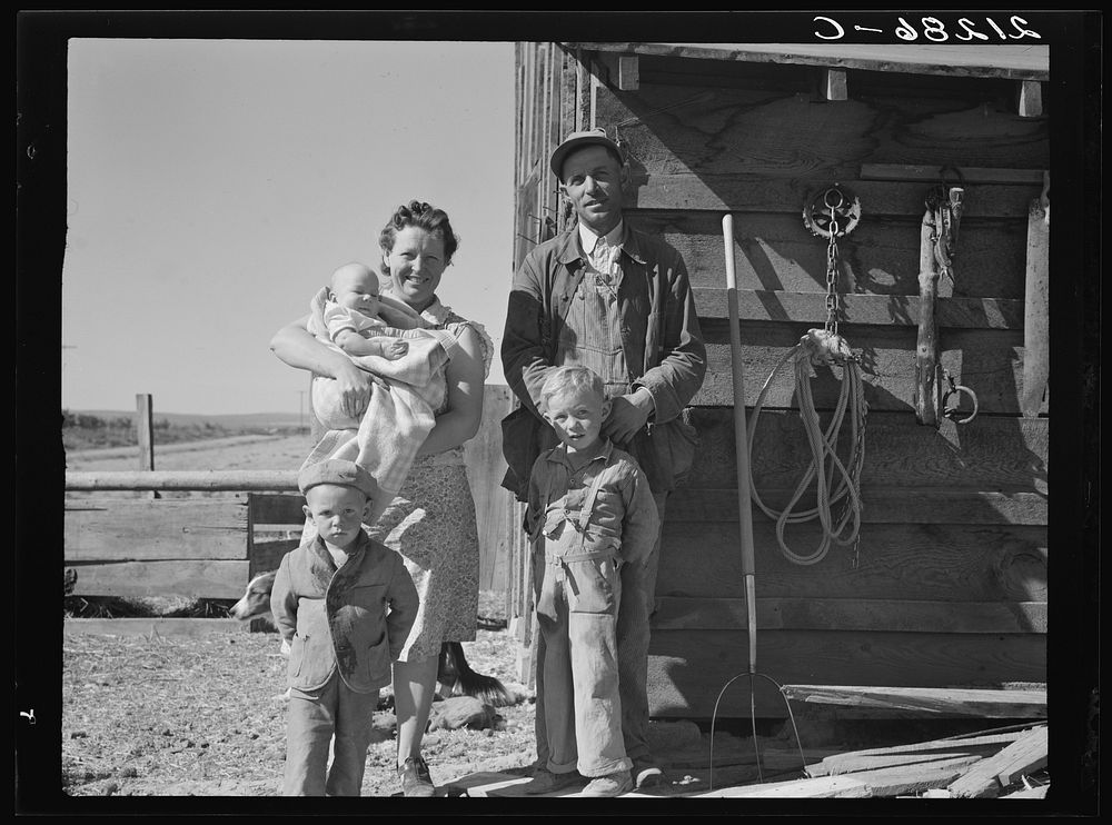 The Schroeder family on their new farm. When they first came two years ago lived in shed shown. Dead Ox Flat, Malheur…