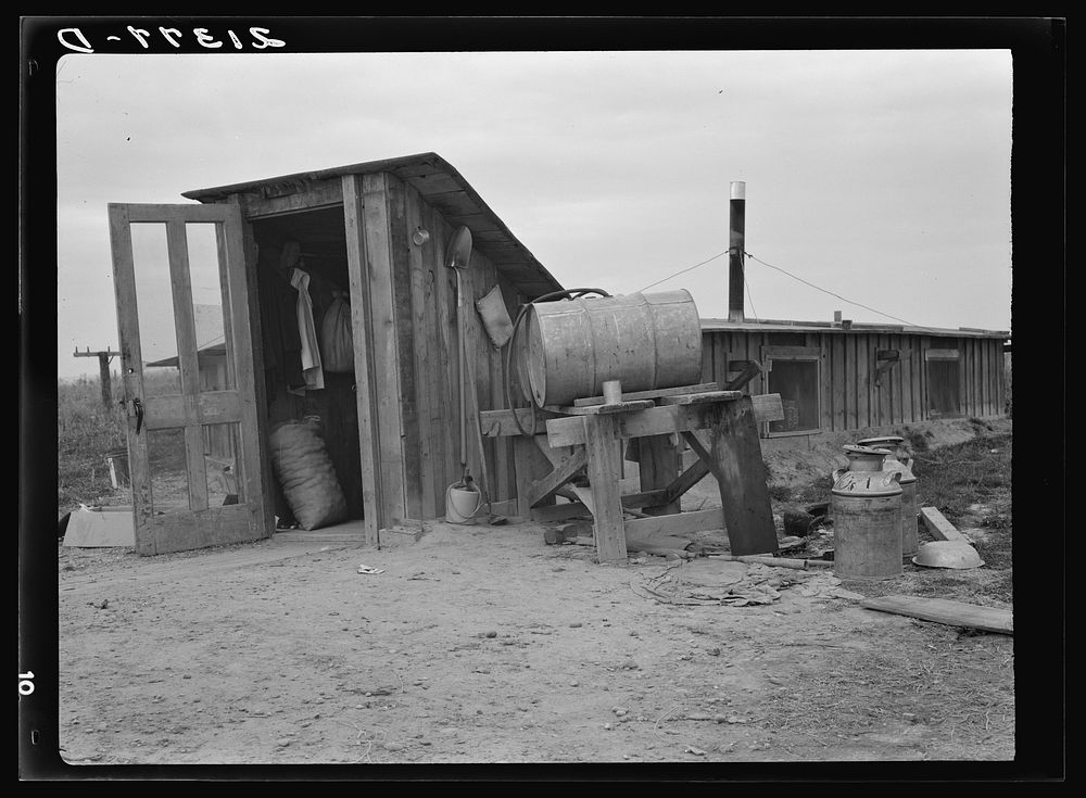 [Untitled photo, possibly related to: Mr. and Mrs. Wardlow at entrance to their dugout basement home. Dead Ox Flat, Malheur…