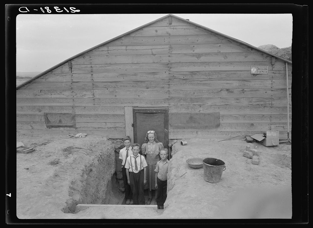 The Free children in doorway of their home in Sunday clothes. Dead Ox Flat, Malheur County, Oregon. Sourced from the Library…