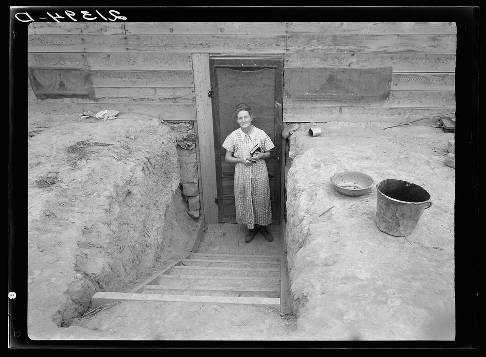 [Untitled photo, possibly related to: Mrs. Free in doorway of her basement dugout home. Dead Ox Flat, Malheur County…