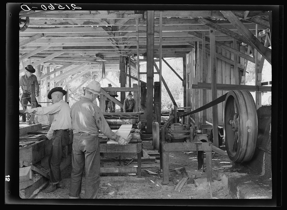 The sawmill in operation. It was built by the farmer members of the Ola self-help sawmill co-op. Gem County, Idaho. General…