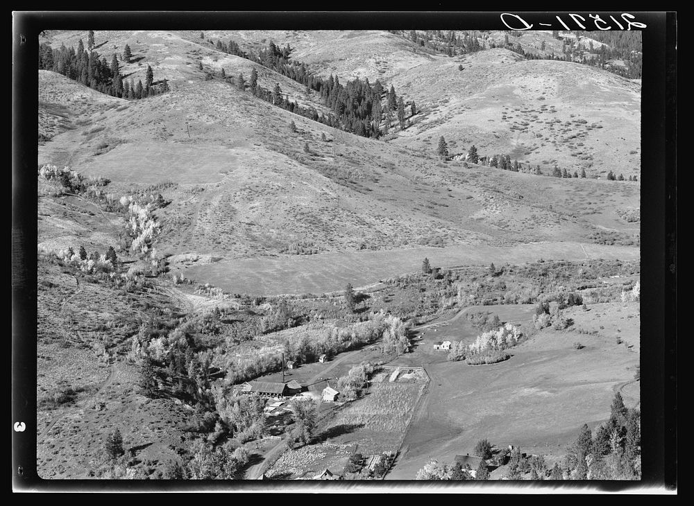 [Untitled photo, possibly related to: Looking down on Ola self-help co-op mill showing the upper end of Squaw Creek Valley…