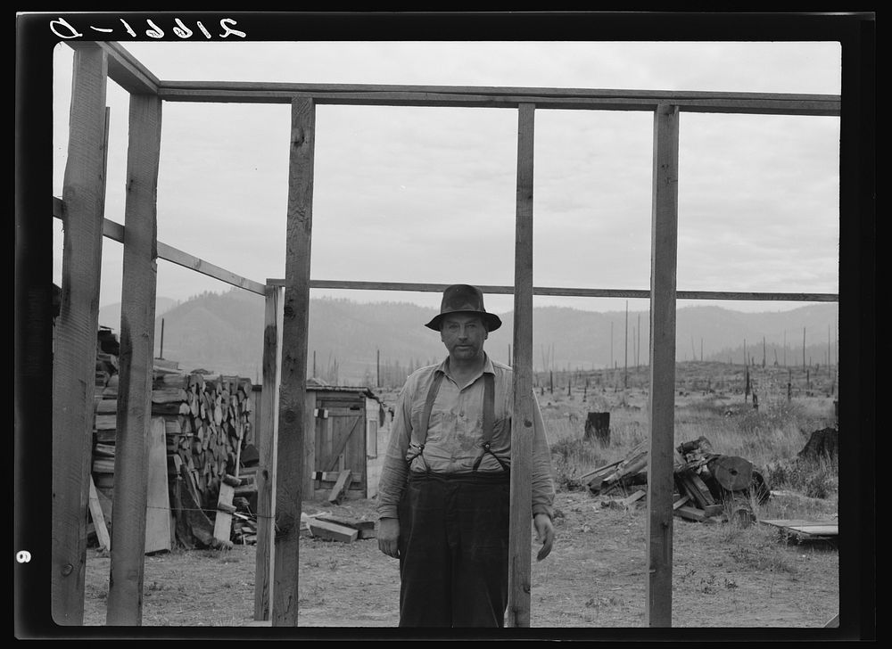 Burned out in Montana, this farmer is making a new start on cut-over land. Priest River country. Bonner County, Idaho.…